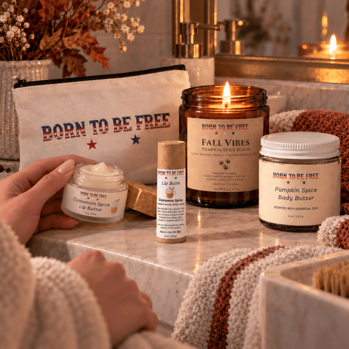 The Fall Ritual Set with Pumpkin Spice Body Butter, Cinnamon Spice Lip Balm, and Fall Vibes candle on a cozy vanity.