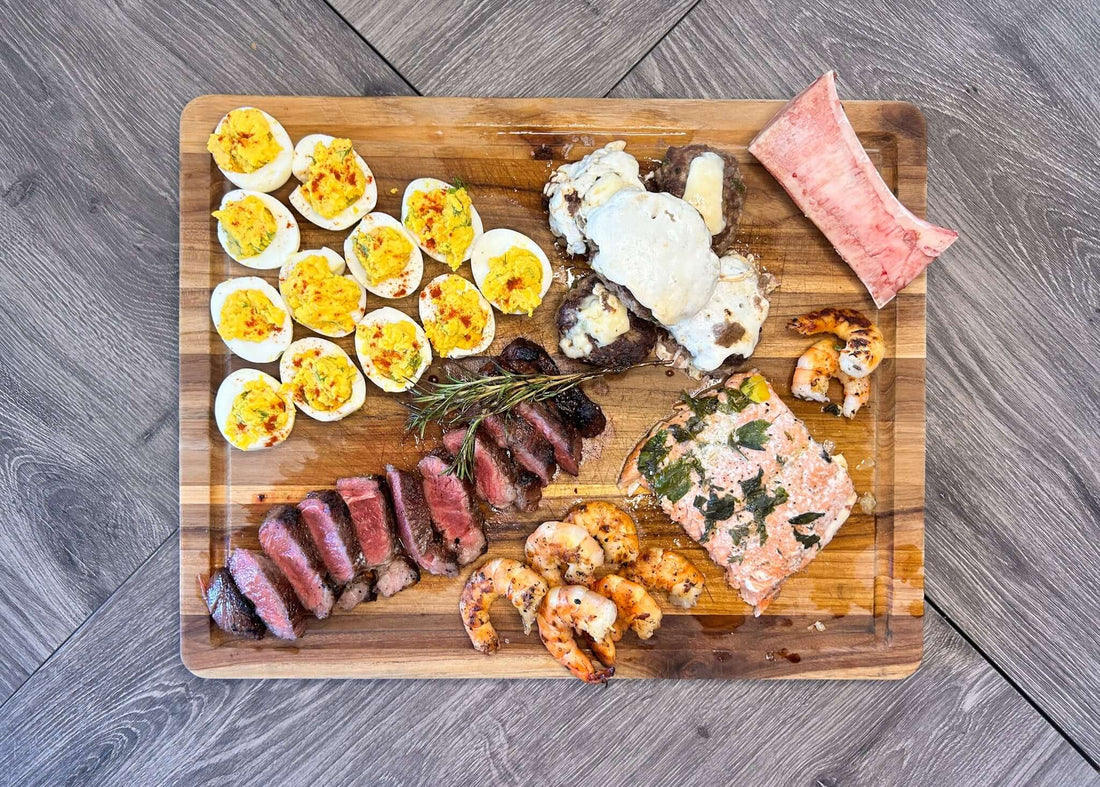 Nourishment Is Freedom- How Whole Foods Empower Your Health & Life displayed on a wooden platter with assorted dishes.