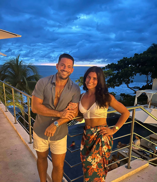 Interview With Canvas Rebel- About the Born To Be Free Brand featuring two individuals at a scenic beach setting.