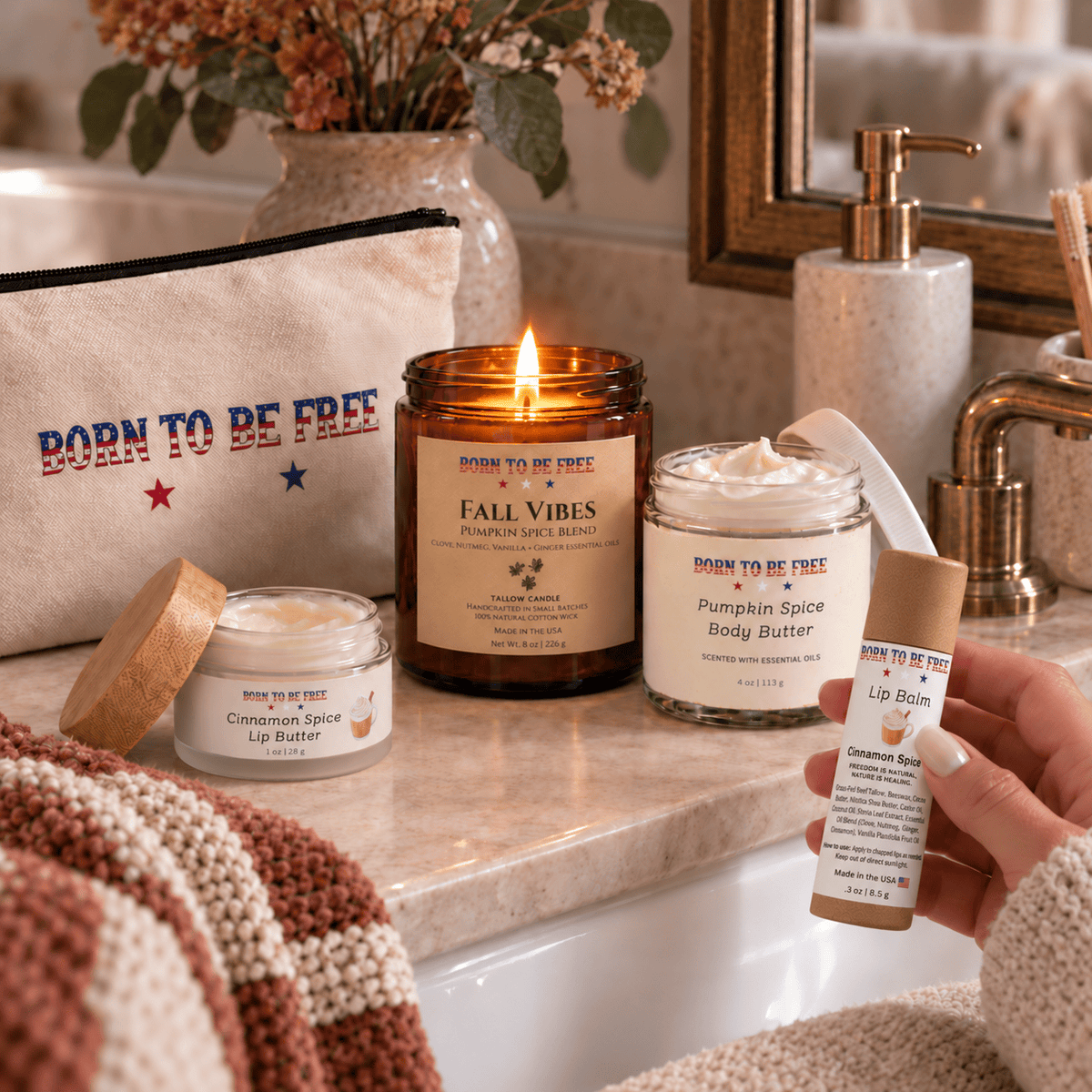 The Fall Ritual Set featuring Pumpkin Spice Body Butter, Cinnamon Spice Lip Butter, and a candle on a serene vanity.
