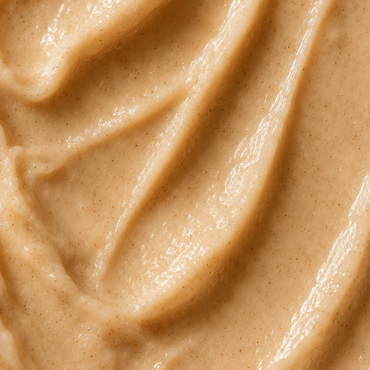Cinnamon Spice Tallow Lip Butter showing a creamy, rich texture perfect for nourishing dry lips.