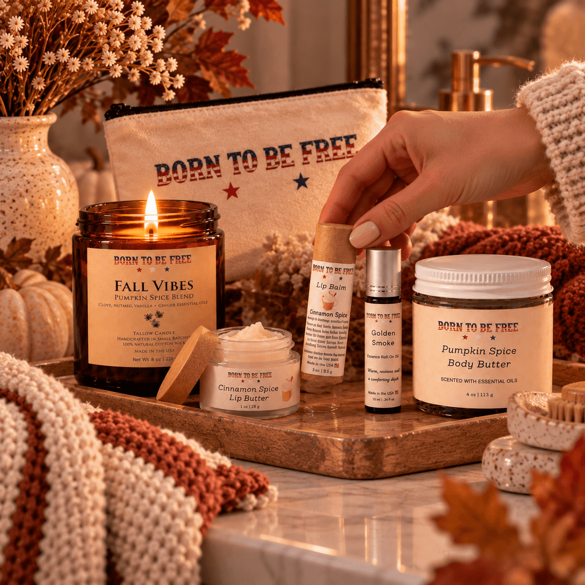 The Fall Ritual Set featuring pumpkin spice candle, body butter, and lip care items in a cozy autumn setting.