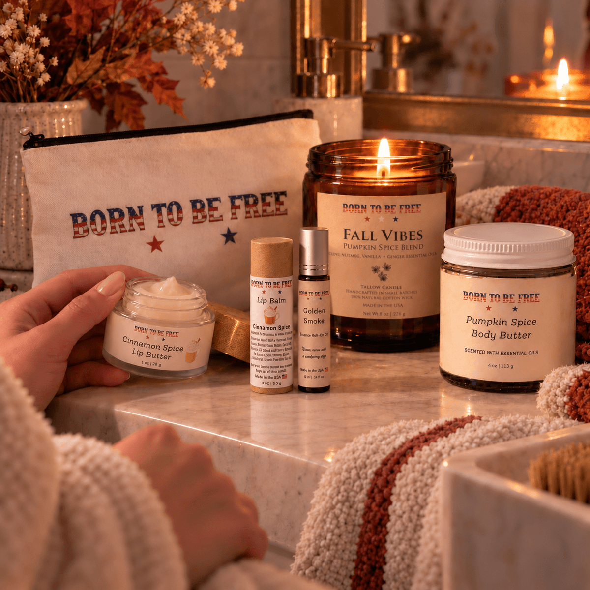 The Fall Ritual Set displayed with Pumpkin Spice Body Butter, Cinnamon Spice Lip Butter, and a warm candle.