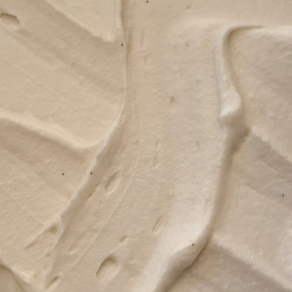 Sweet Almond Body Butter texture close-up, showcasing its rich, creamy consistency.