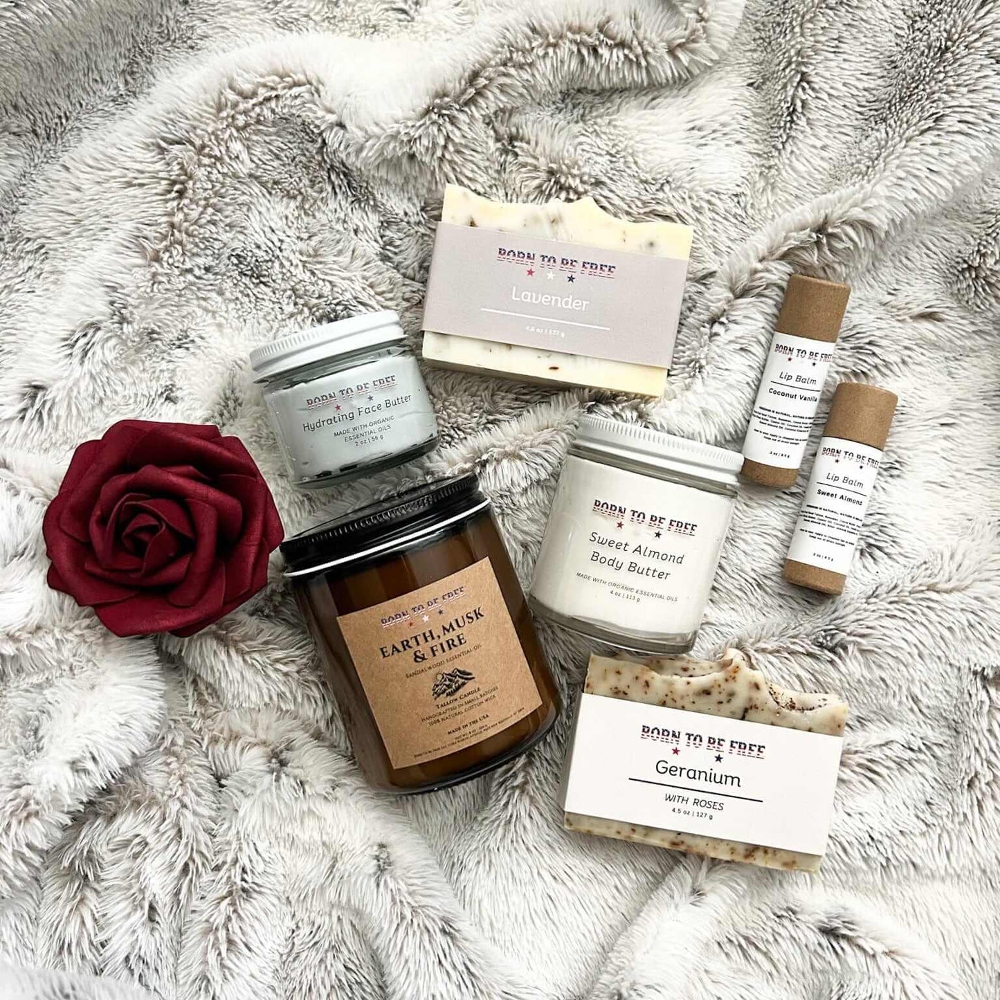 Valentines Day Sweetheart Box-Large featuring candles, body butter, soaps, and rose on a fluffy backdrop.