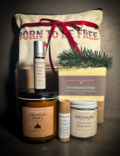 Winter Woods Holiday Bundle displayed with Born To Be Free travel pouch and toxin-free winter skincare collection.