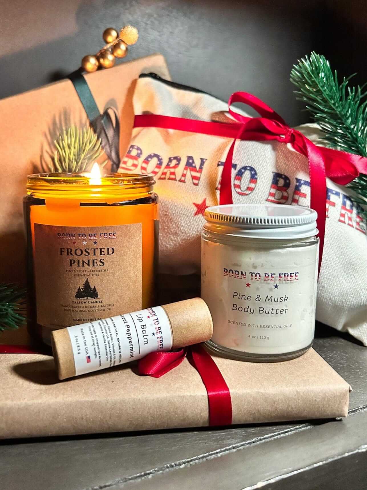 Pine and Mint Holiday Gift Set displayed with Born To Be Free travel pouch and minimalist winter packaging for seasonal self-care.