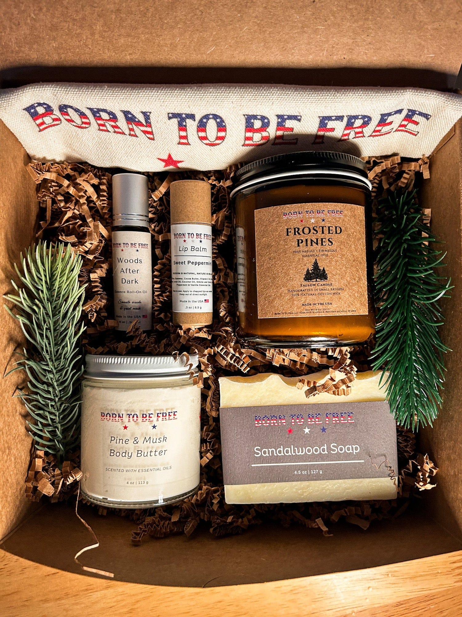 Winter Woods Holiday Bundle featuring tallow skincare and candle set inspired by pine forests and cozy nights