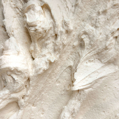 Close-up of smooth and creamy Vanilla Bean Body Butter texture, showcasing its rich, whipped consistency.