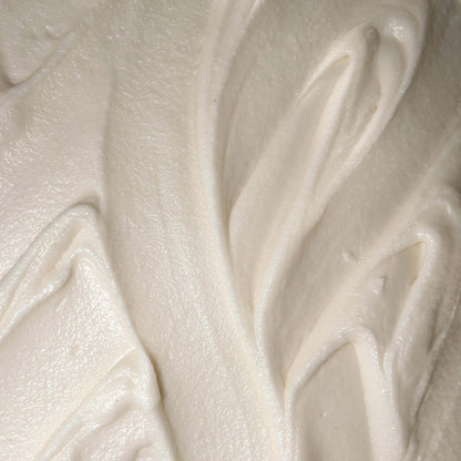 Creamy texture of Smoked Cedar Body Butter, a rich moisturizer for deeply nourishing and hydrating the skin.