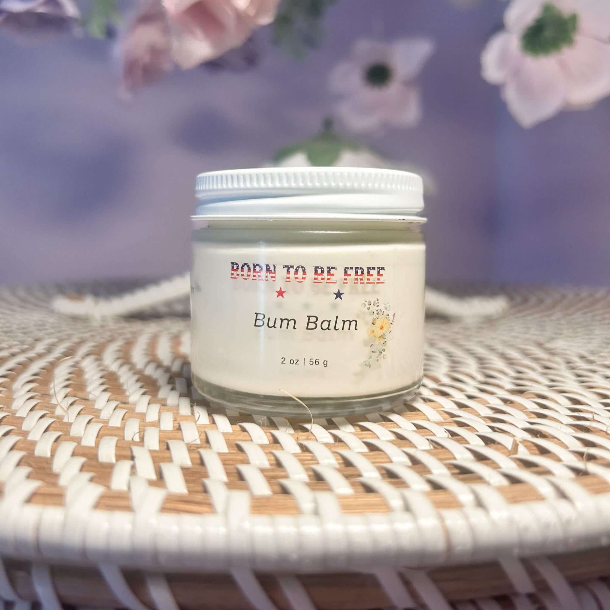 Bum Balm - Baby Diaper Cream with Tallow + Zinc in a jar on a woven basket.