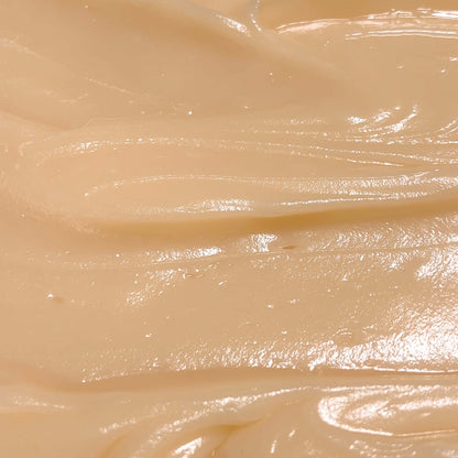 Close-up of silky Extra Hydrating Body Butter texture, showcasing its creamy and nourishing properties.