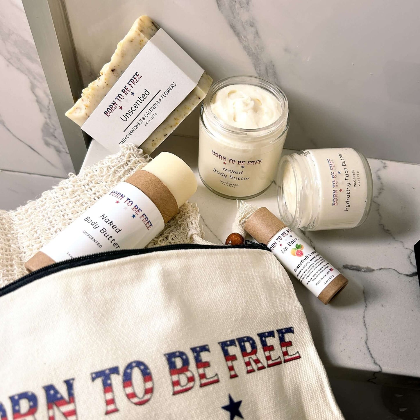 Pure Freedom Bundle including non-toxic skincare products on marble background.