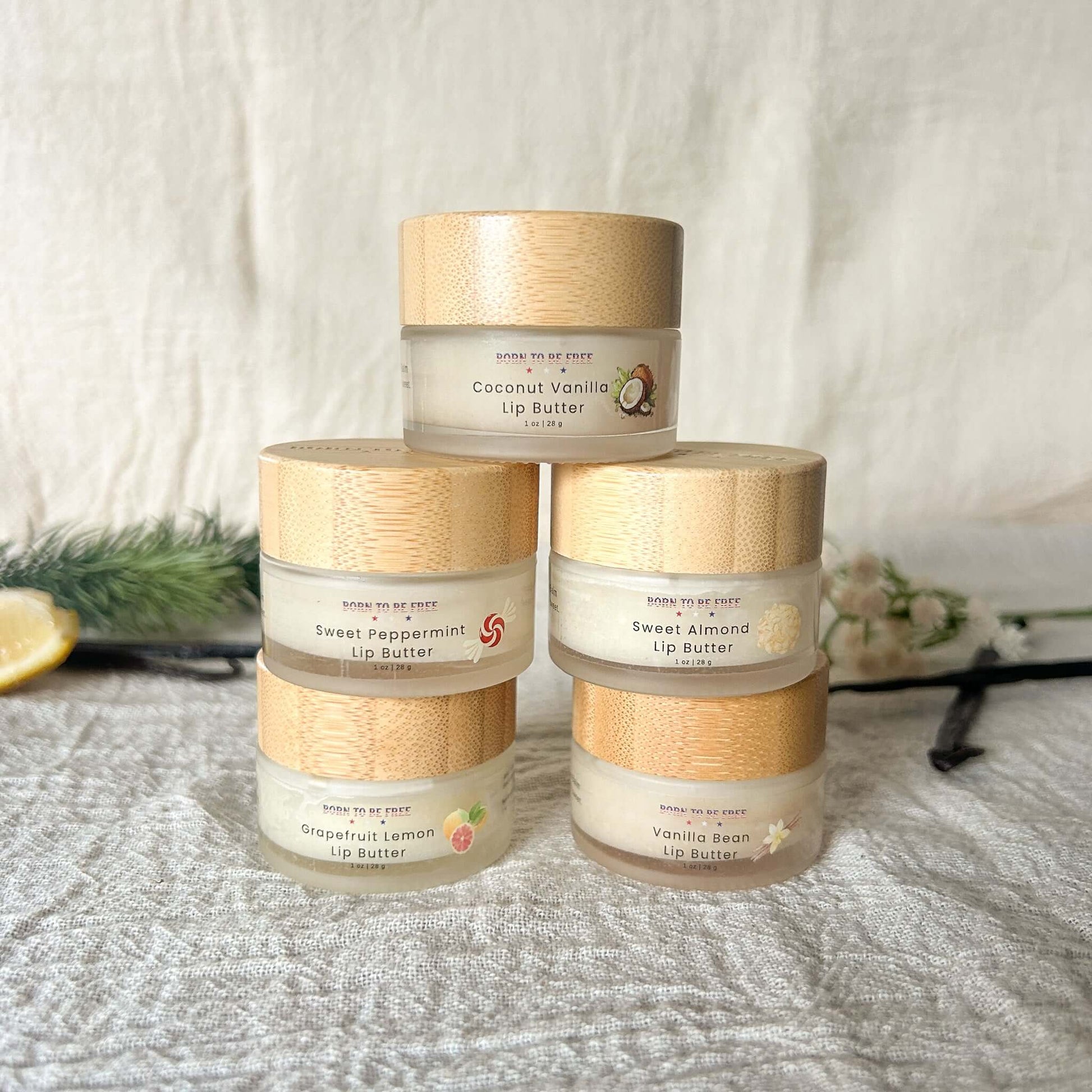 Tallow Lip Butter Set featuring Coconut Vanilla, Sweet Peppermint, Sweet Almond, Grapefruit Lemon, and Vanilla Bean lip butters.