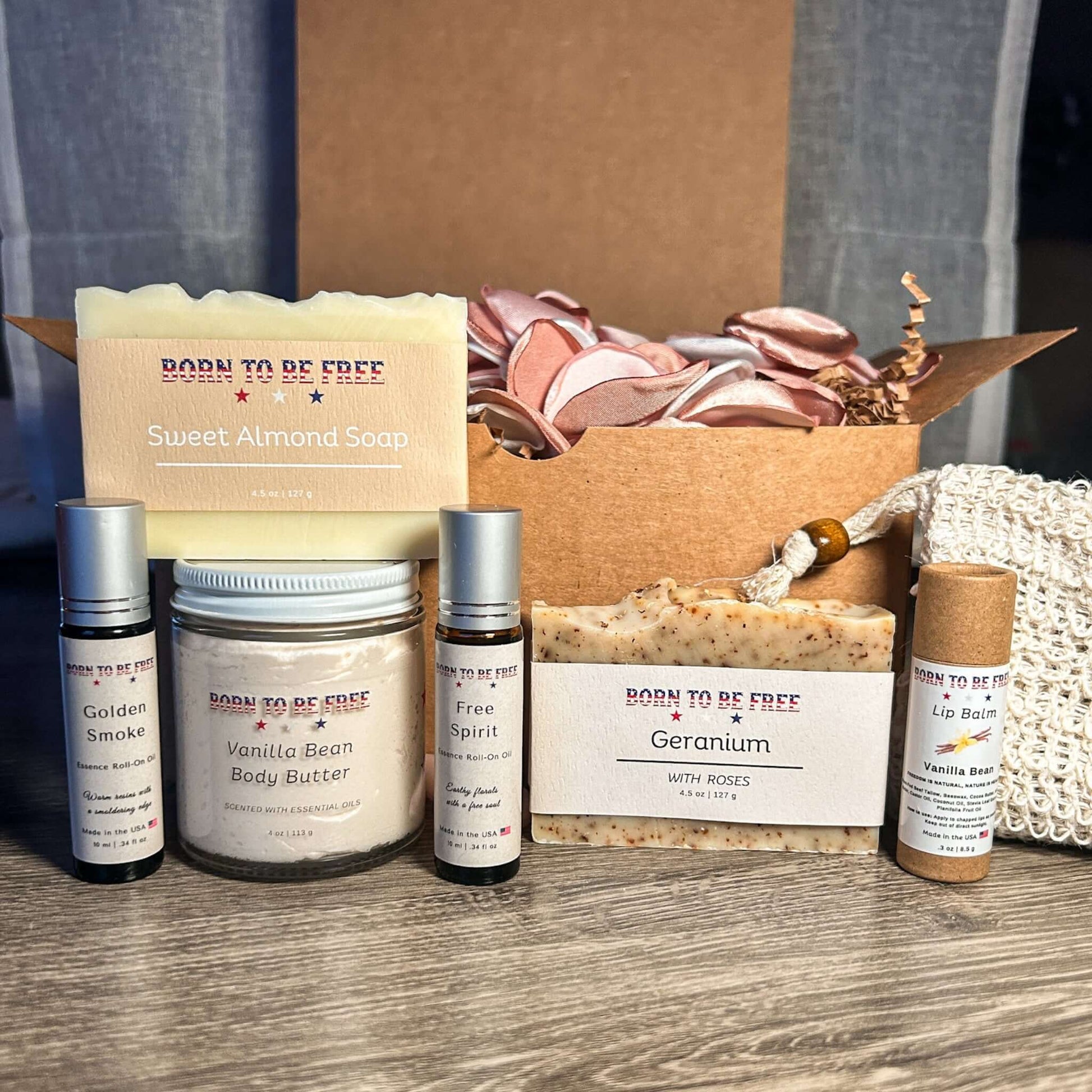Lover’s Bundle containing Sweet Almond Soap, Vanilla Bean Body Butter, Free Spirit fragrance, and skincare essentials.