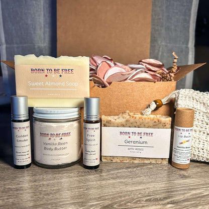 Lover’s Bundle containing Sweet Almond Soap, Vanilla Bean Body Butter, Free Spirit fragrance, and skincare essentials.