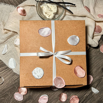 Lover’s Bundle gift box adorned with decorative petals on a rustic wooden surface.Valentines Day Plain Jane Box-Large Valentines Day Plain Jane Box-Small Valentines Day Sweetheart Box-Large Valentines Day Sweetheart Box-Small