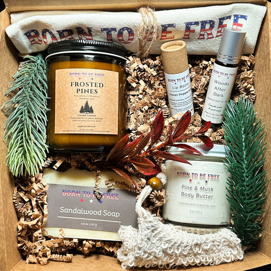 Winter Woods Holiday Bundle featuring tallow skincare, candle, soap and lip balm, and our most-loved essence roll-on scent for winter gifting and cold weather skin care